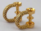 Appraisal: A pair of French hallmarked carat gold stirrup cuff links