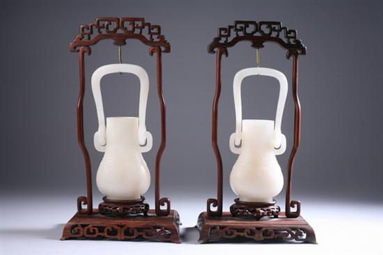 Appraisal: PAIR CHINESE WHITE JADE VASES AND STANDS Guangxu period Of