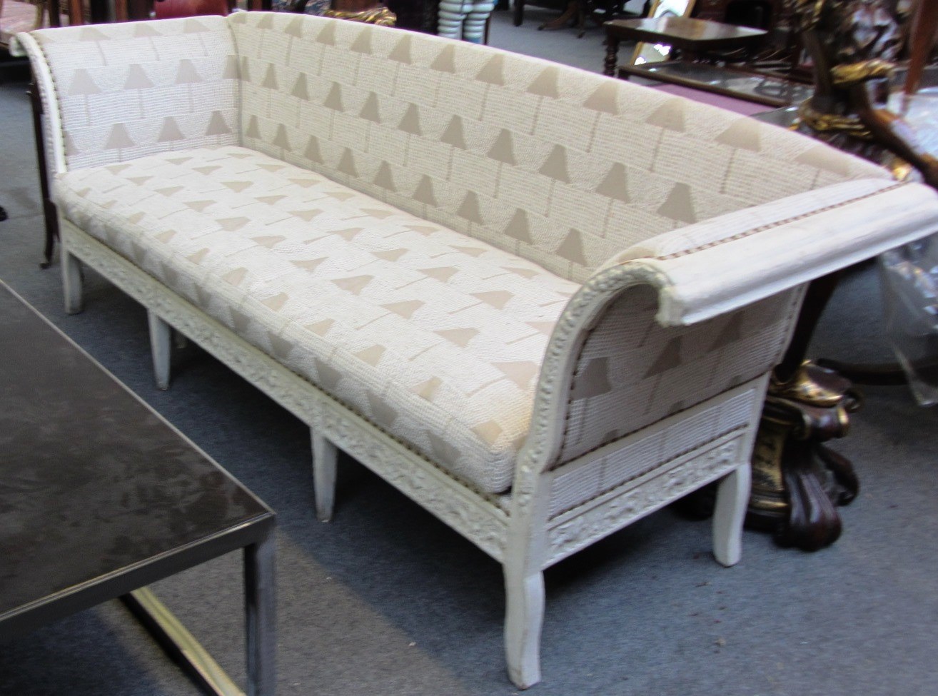 Appraisal: A th century cream painted North European sofa with carved