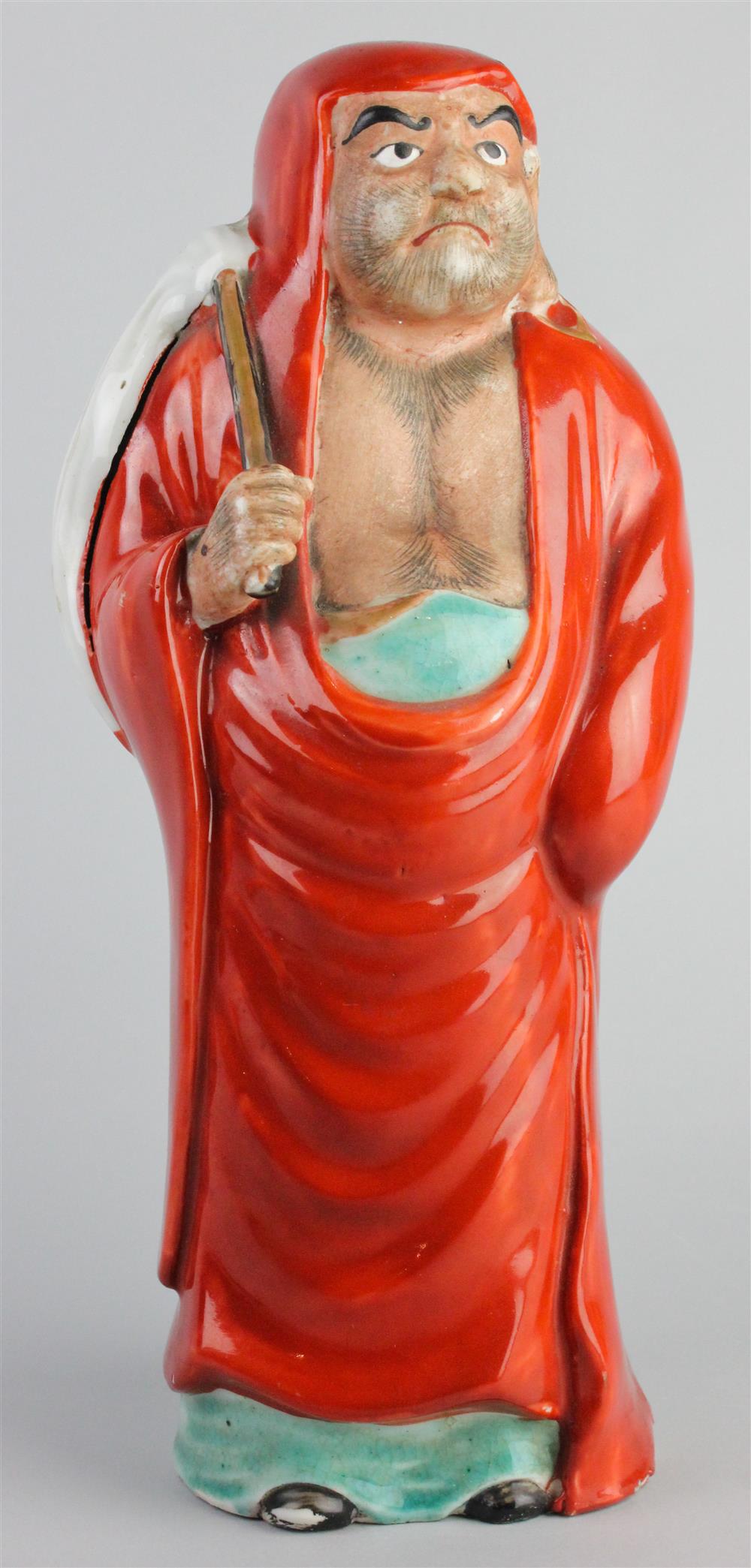 Appraisal: JAPANESE KUTANI FIGURE OF DARUMA the standing monk draped in