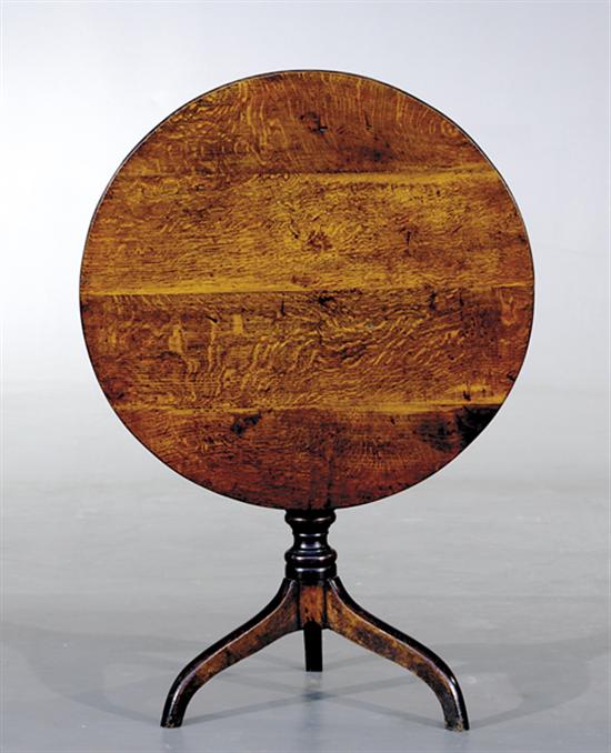 Appraisal: English oak tilt-top table circa circular top over baluster-turned stem