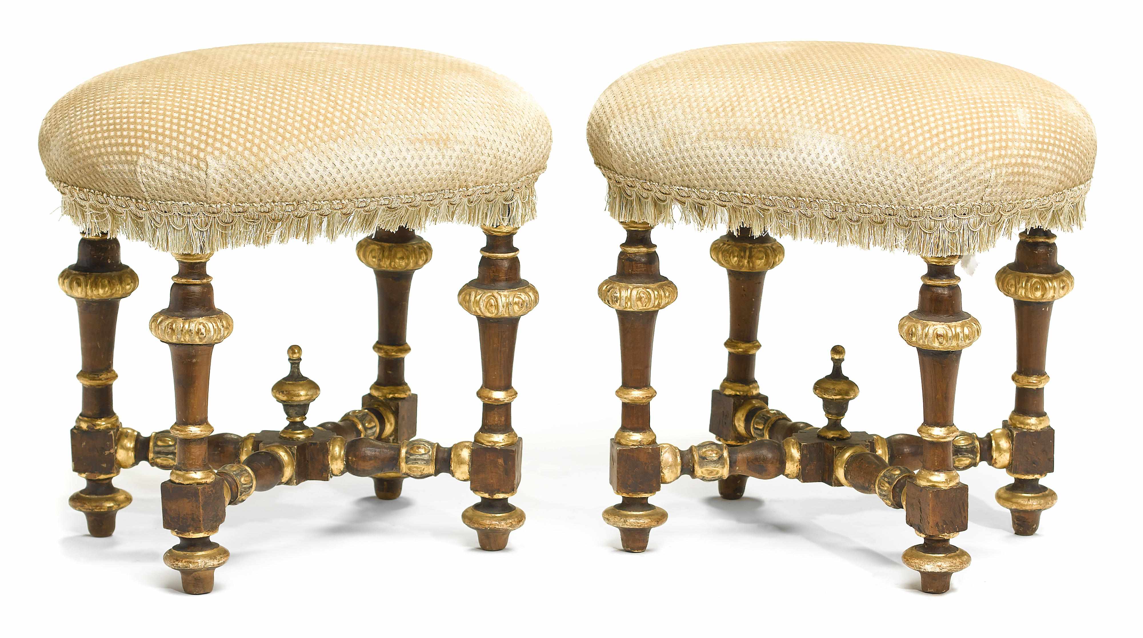 Appraisal: A pair of Italian Baroque style parcel gilt fruitwood stools