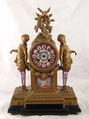 Appraisal: A continental gilt mantel clock striking on a bell the