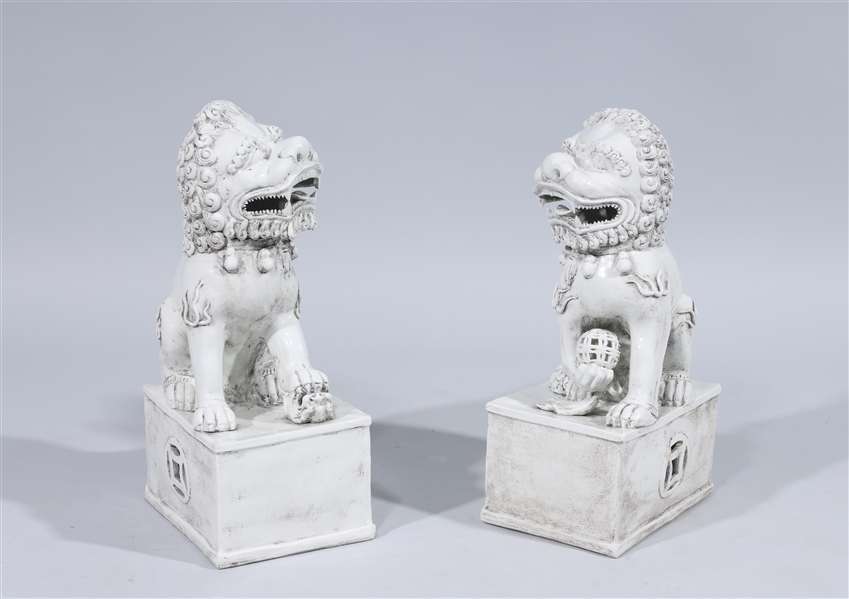 Appraisal: Pair of white Chinese porcelain foo lions with four-character mark