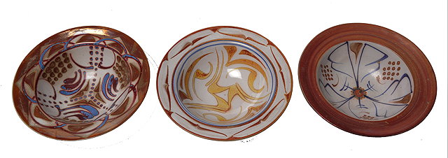 Appraisal: AN ALAN CAIGER-SMITH DESSERT BOWL red oxide rim and decorated