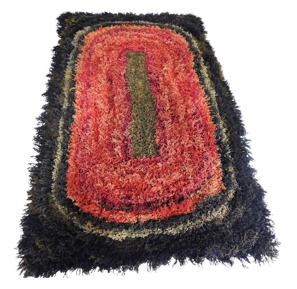 Appraisal: RUG Floor rug with strips of raveled knitted material for