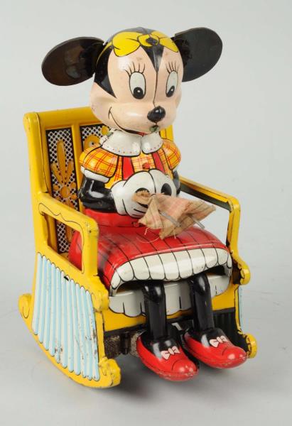 Appraisal: Minnie Mouse Seamstress Tin Wind-Up Toy By Linemar Light scattered