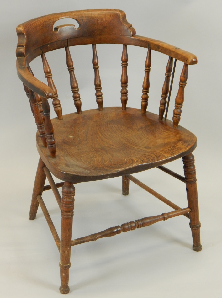 Appraisal: A late thC ash and elm captain's type office chair