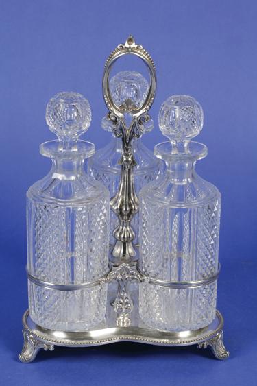 Appraisal: A VICTORIAN DECANTER STAND with a central beaded loop handle