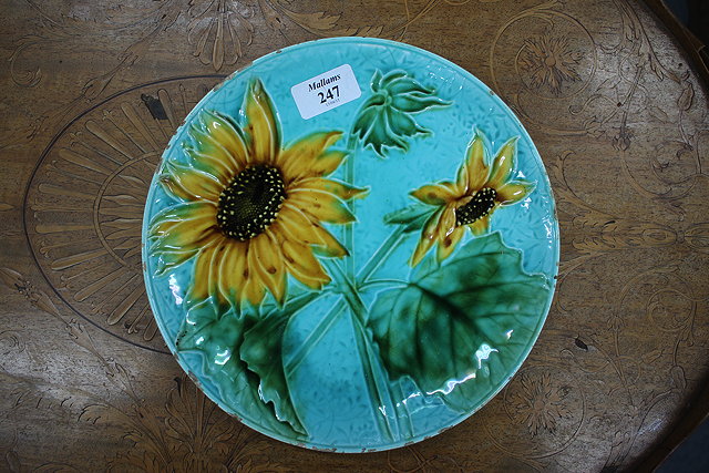 Appraisal: A VICTORIAN MAJOLICA PLATE decorated with sunflowers stamped to the