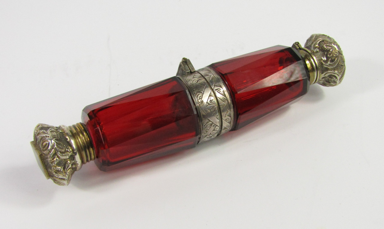 Appraisal: A Victorian cranberry faceted glass scent and smelling salts bottle