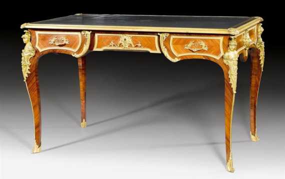 Appraisal: BUREAU PLAT AUX BUSTES DE ROMAINS Regence style after designs