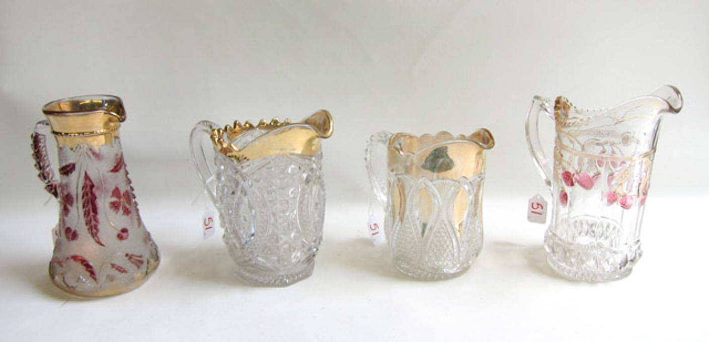 Appraisal: FOUR VICTORIAN GLASS PITCHERS in various patterns including a strawberry