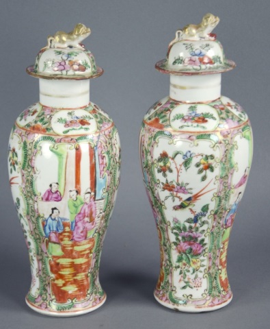 Appraisal: Pair of Rose Medallion Lidded UrnsDecorated with alternating panels of