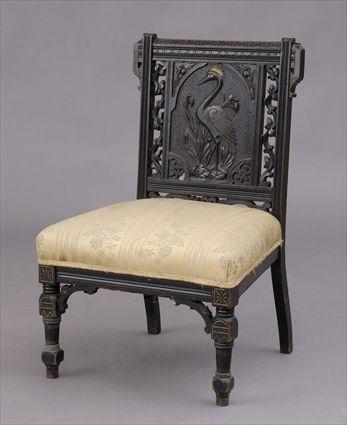 Appraisal: AMERICAN AESTHETIC MOVEMENT EBONIZED AND GILT-INCISED SLIPPER CHAIR The rectangular