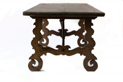 Appraisal: An th Century Spanish walnut low table on carved end