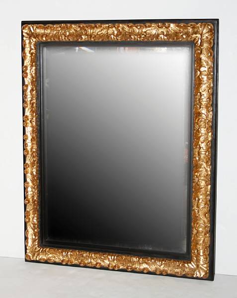 Appraisal: A Baroque style giltwood and parcel ebonized mirror height in