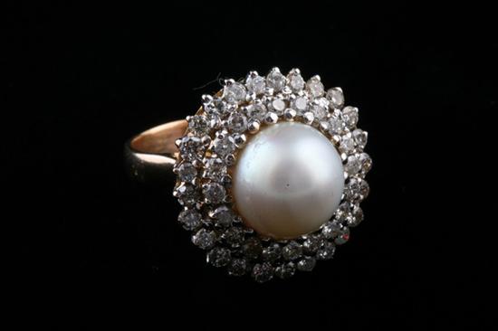 Appraisal: YELLOW GOLD PEARL AND DIAMOND RING mm white pearl surrounded