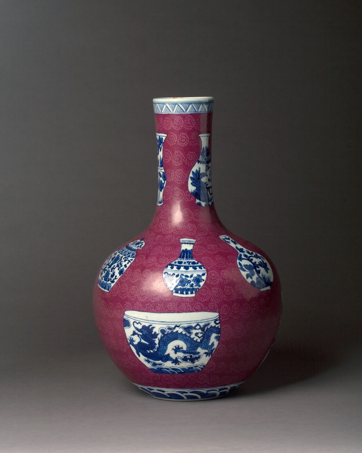 Appraisal: CHINESE PORCELAIN PLUM-GROUND BOTTLE VASE Reserved overall with a variety