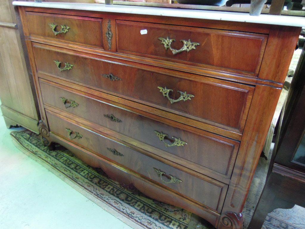 Appraisal: A th century continental mahogany commode fitted with three long