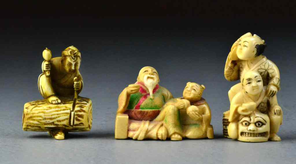 Appraisal: Japanese Carved Ivory NetsukeFinely carved to depict villagers in various