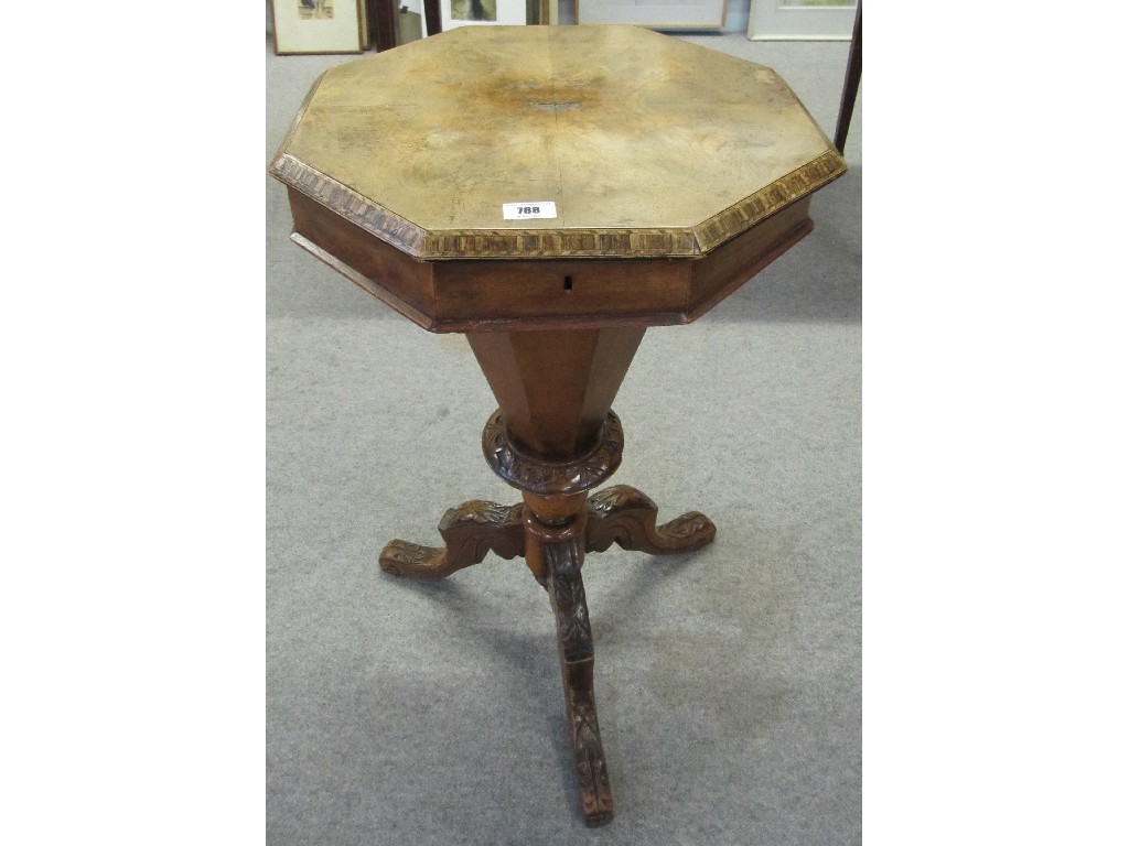 Appraisal: Victorian walnut octagonal sewing table raised on an octagonal pillar