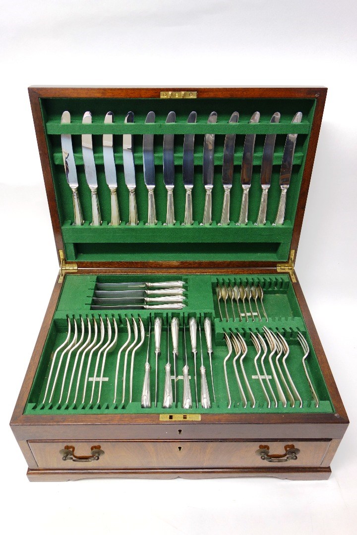 Appraisal: A canteen of silver Hanoverian pattern flatware comprising twelve table