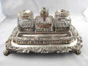 Appraisal: An Old Sheffield Plate Treasury inkstand on paw feet with