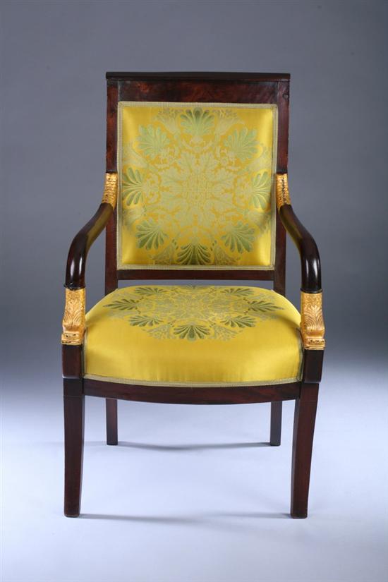 Appraisal: FRENCH EMPIRE MAHOGANY AND PARCEL-GILT FAUTEUIL Early th century with