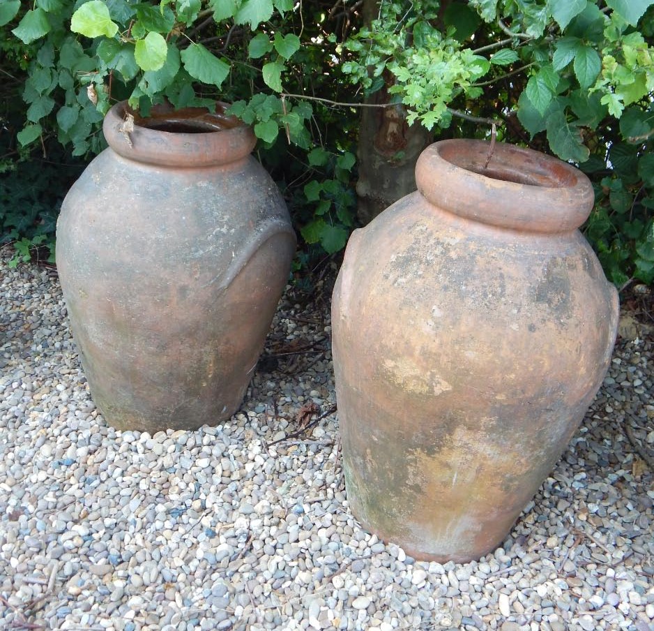 Appraisal: A pair of terracotta garden vases each with two handles