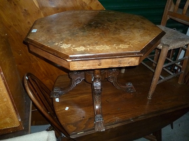 Appraisal: A VICTORIAN WALNUT OCTAGONAL OCCASIONAL TABLE the quarter veneer top