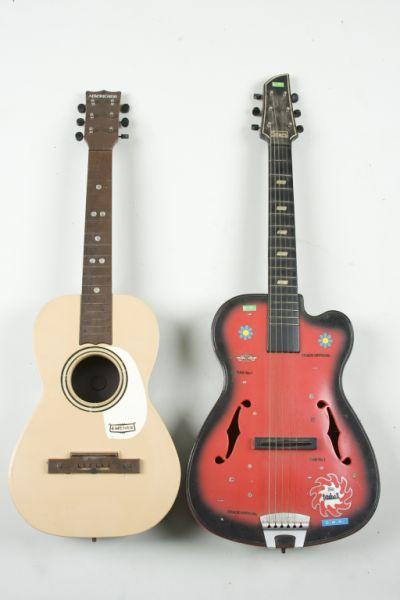 Appraisal: Two Vintage Plastic Guitars the first an Emenee Americana six-string