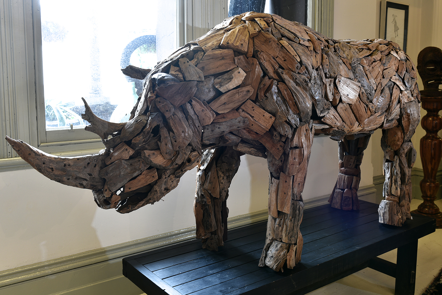 Appraisal: AN IMPRESSIVE SCULPTURE OF A RHINO COMPOSED FROM TIMBER FRAGMENTS