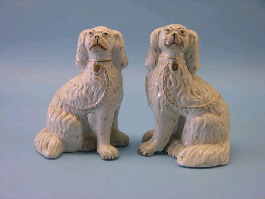 Appraisal: A pair of Victorian Staffordshire earthenware comforter spaniels each with