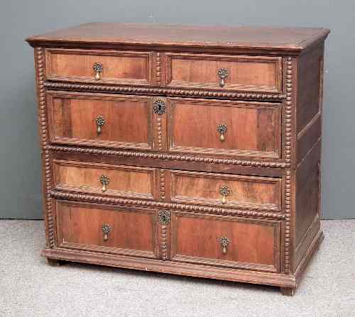 Appraisal: A late th Century panelled oak and walnut veneered chest