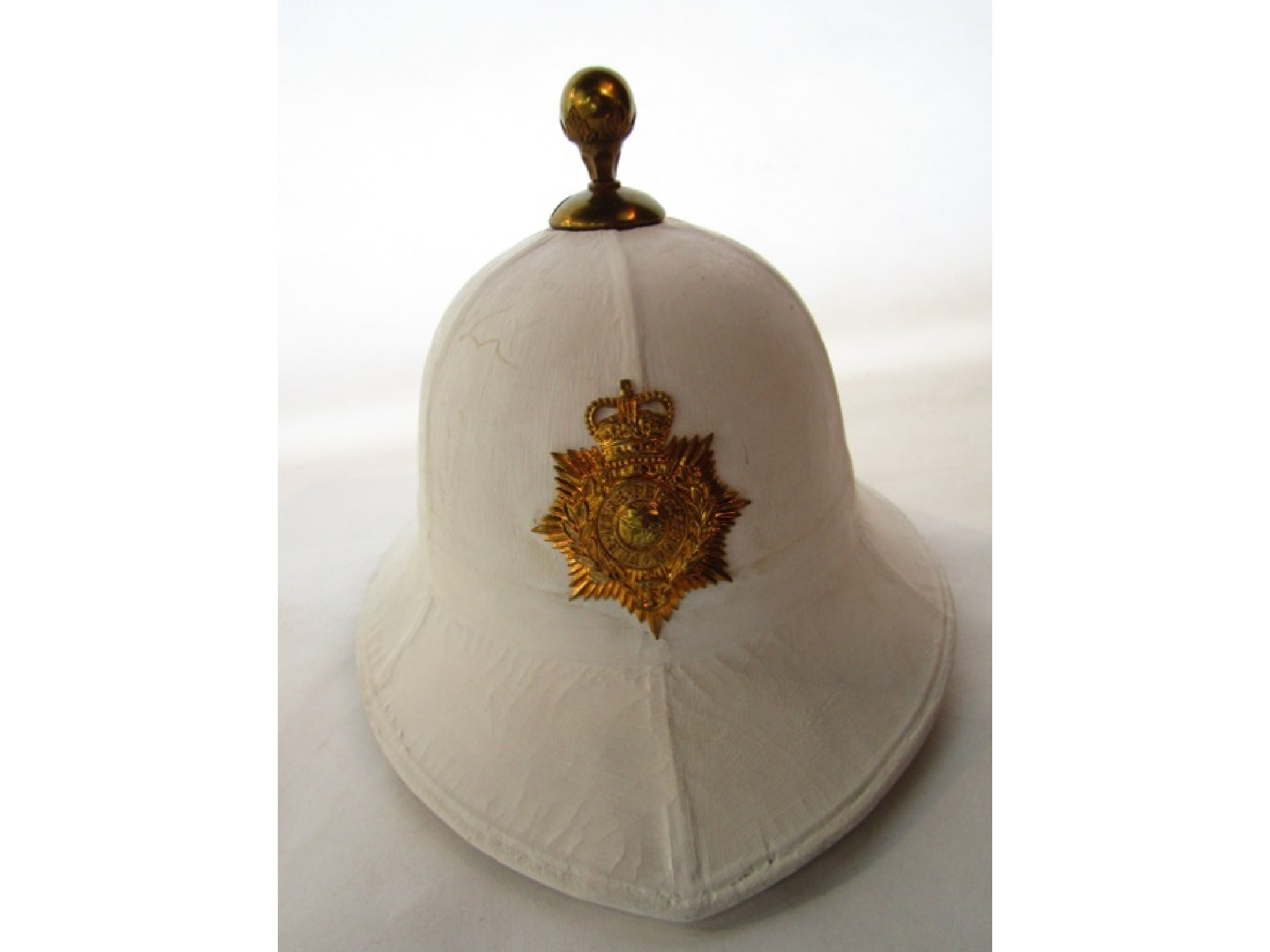 Appraisal: A Royal Marine white pith dress helmet with applied gold