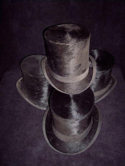 Appraisal: Four assorted black silk top hats