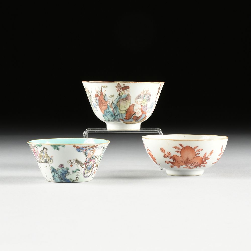 Appraisal: A GROUP OF THREE QING DYNASTY PORCELAIN TEA BOWLS -