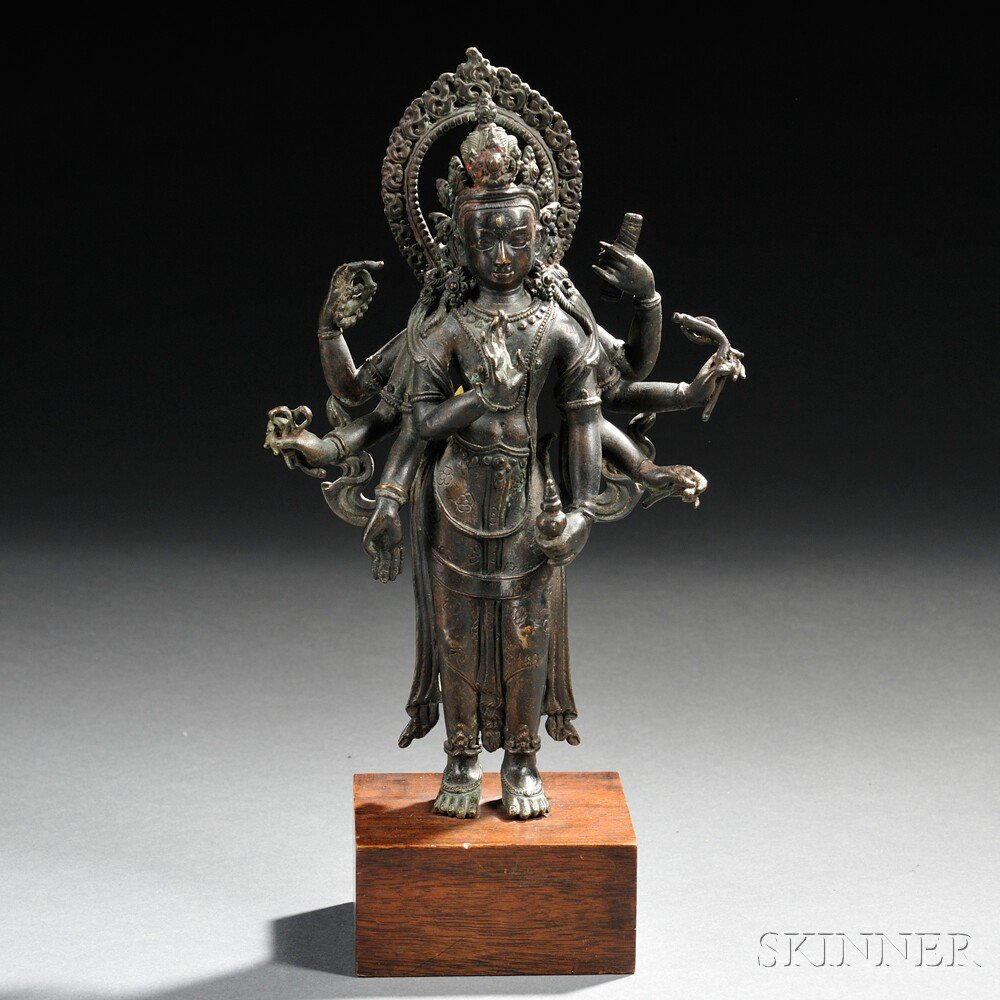 Appraisal: Bronze Avalokitesvara Southeast Asia the figure standing his eight hands