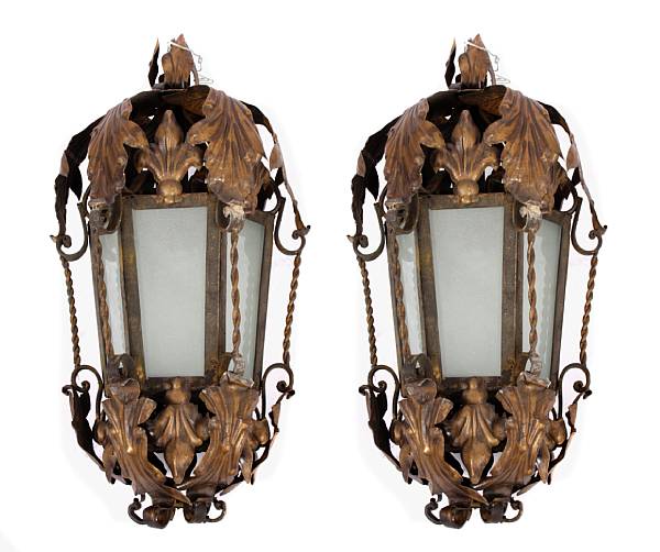 Appraisal: A pair of tole and wrought iron lanterns height diameter