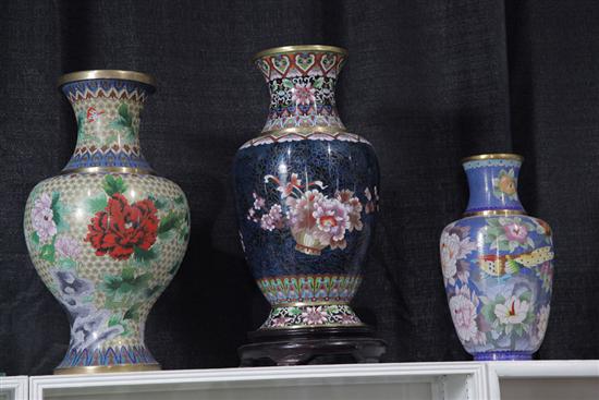 Appraisal: THREE CLOISONNE VASES Floral on dark blue ''h bird and