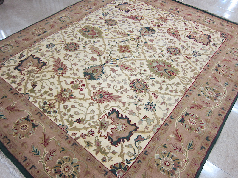 Appraisal: HAND KNOTTED ORIENTAL AGRA CARPET overall floral decoration on antique