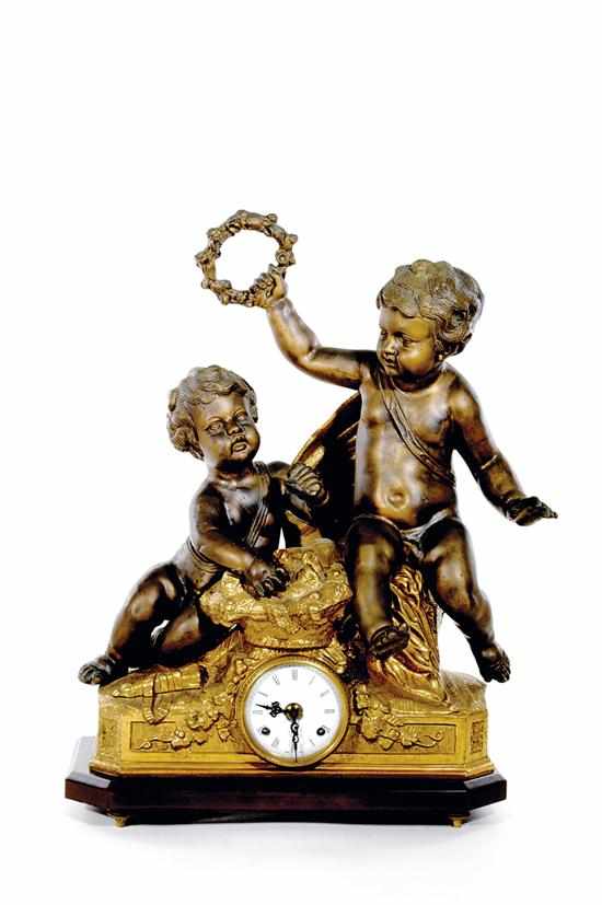 Appraisal: French style bronze mantel clock two putti above fruit-draped case