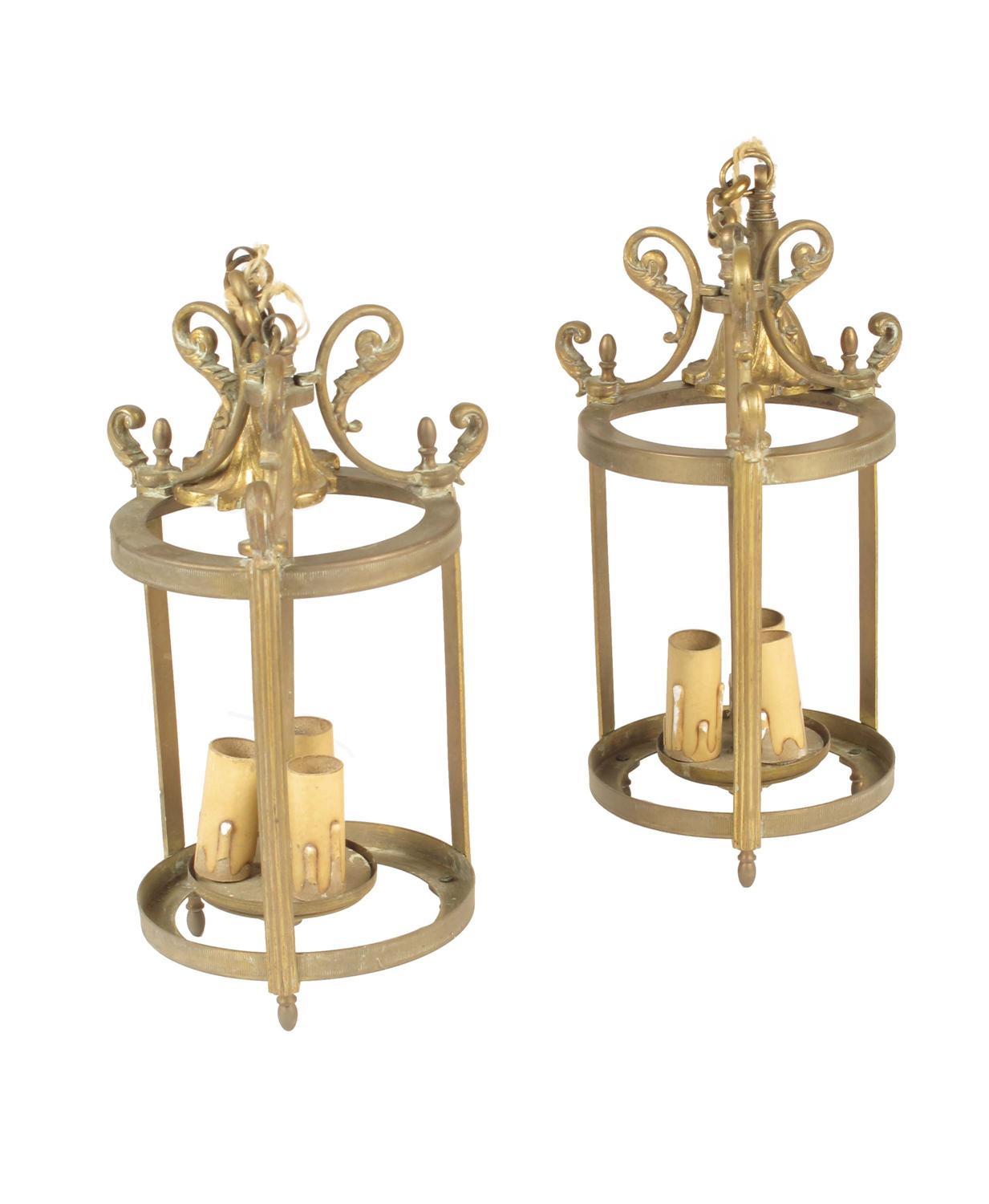 Appraisal: A pair of gilt brass hall lanterns