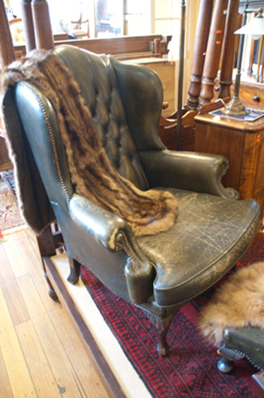 Appraisal: WINGBACK LEATHER UPHOLSTERED ARMCHAIR WITH MATCHING FOOT STOOL