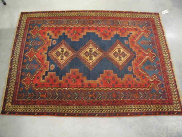 Appraisal: Shiraz Persian Handmade Rug deep rich earthtones geometrics throughout '