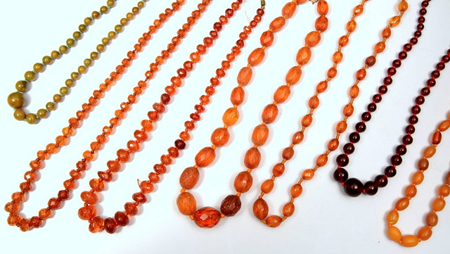 Appraisal: A COLLECTION OF SEVEN VARIOUS AMBER BEAD NECKLACES in various