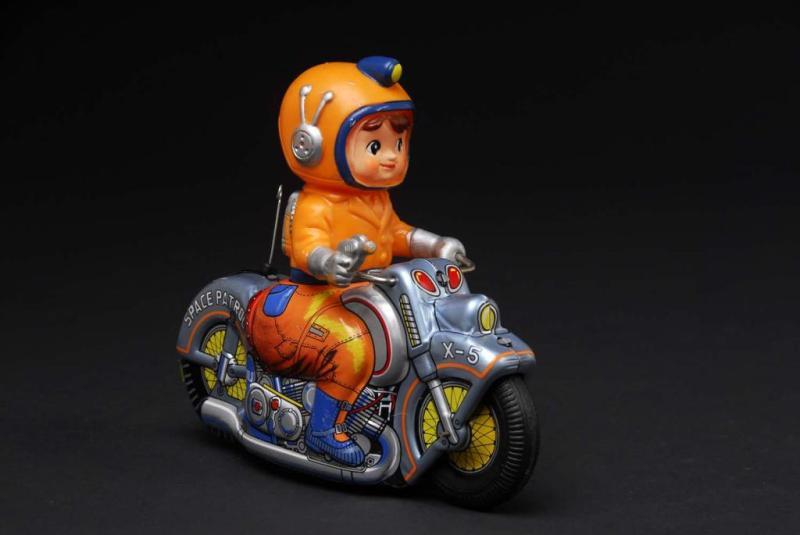 Appraisal: Tin X- Space Patrol Motorcycle Friction Toy Description Japanese Working