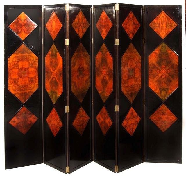 Appraisal: A DECORATIVE SIX FOLD EBONISED DRAUGHT SCREEN inset with burr