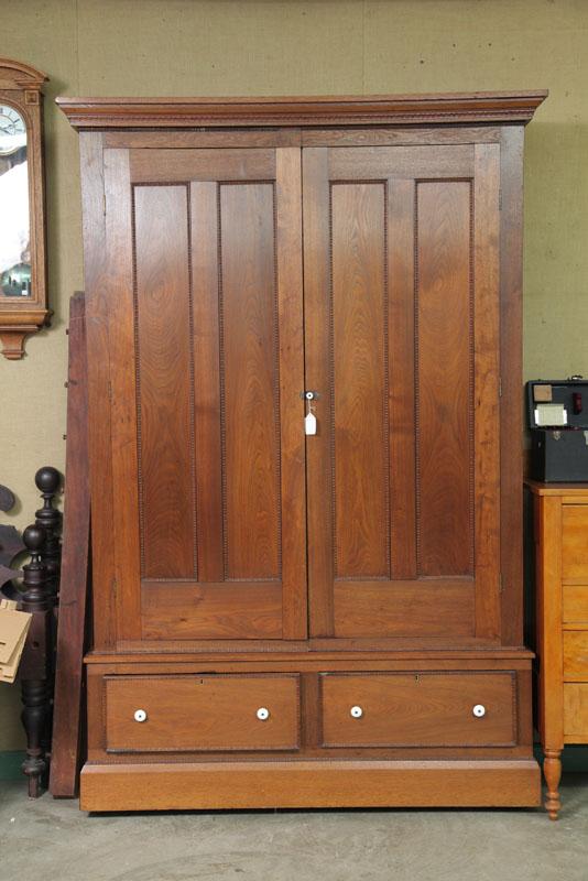 Appraisal: WARDROBE Walnut three part wardrobe with step molded cornice blind